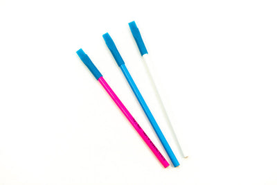 Three Super Cheap Fabrics Marking Pencil - White products, with blue, rectangular textured tips, are arranged diagonally on a white background. The pencils appear pink, blue, and white from left to right.