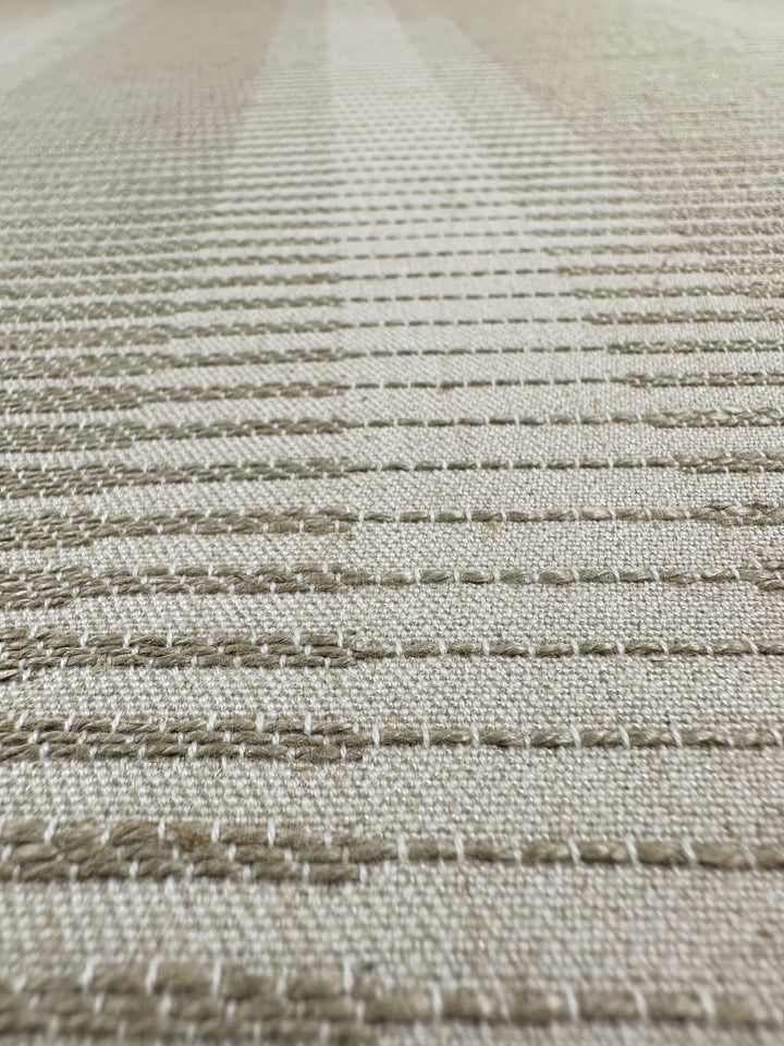 Close-up of Textured Jacquard Upholstery - Melmoth Stripe Nat (142cm) by Super Cheap Fabrics, featuring beige fabric with horizontal stitched lines and a subtle geometric pattern, ideal for premium drapery or upholstery projects.