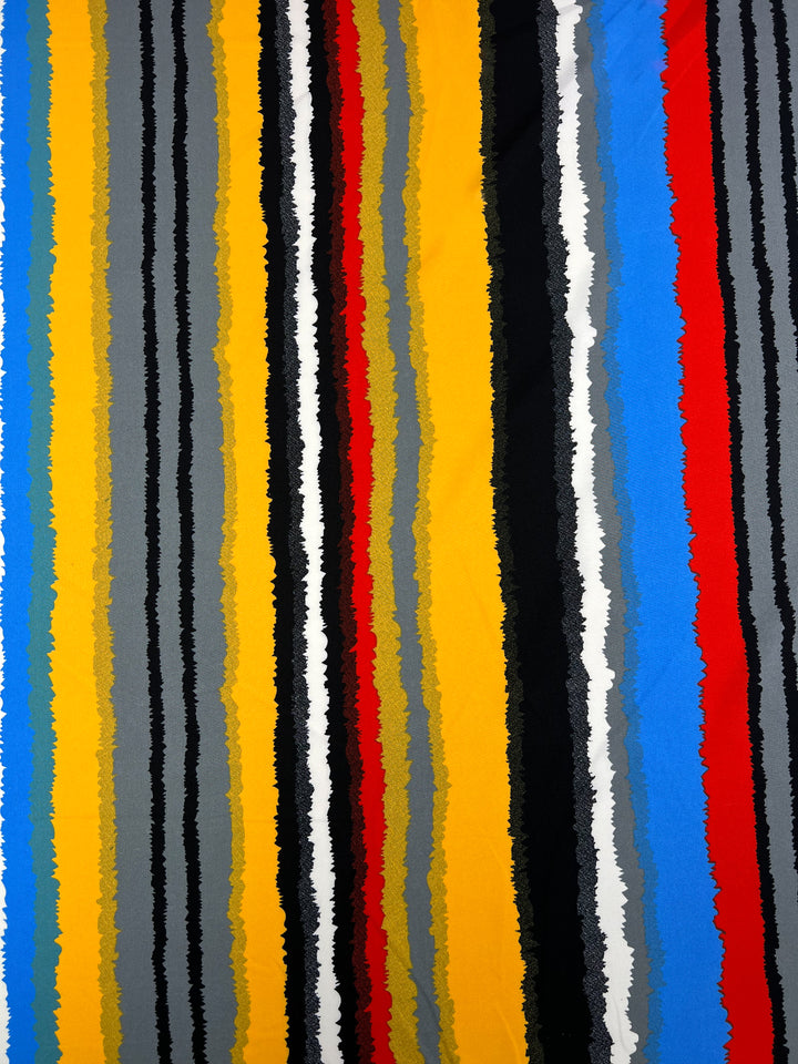 A vibrant abstract pattern featuring vertical jagged stripes in various colors, including yellow, blue, red, black, white, and shades of grey. Perfect for designer fabrics, the Deluxe Print - Neo - 155cm polyester fabric from Super Cheap Fabrics with rough, uneven edges creates a dynamic and energetic appearance.