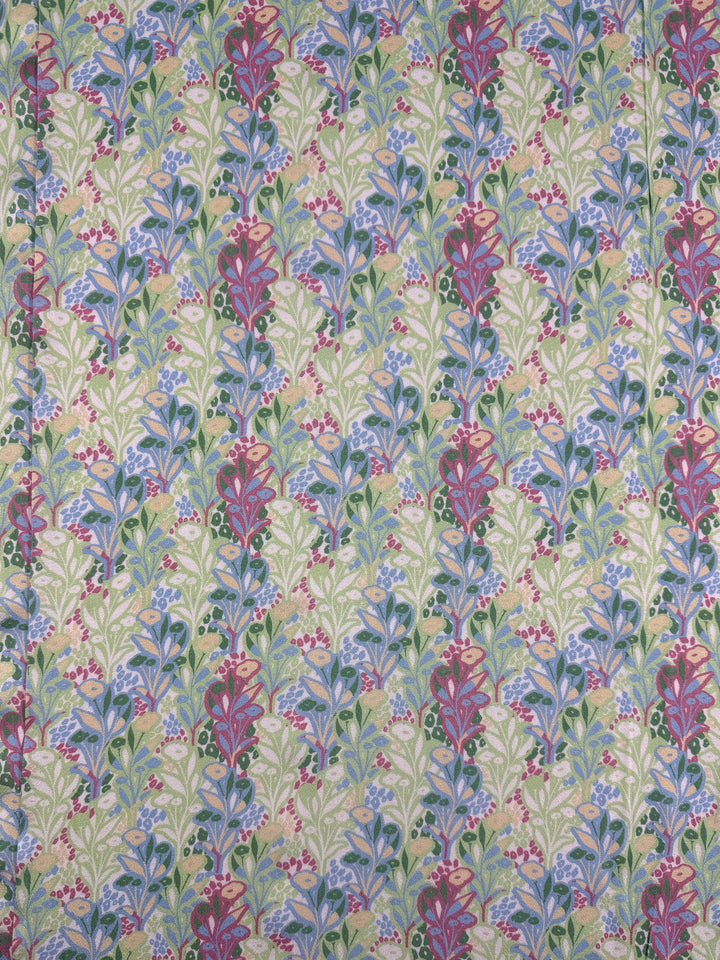 Mercerised Rayon - Garden Vine by Super Cheap Fabrics features a vibrant, symmetrical floral pattern in pink, purple, and blue with green leaves on a light background—ideal for breathable, lightweight garments. Width: 150cm.
