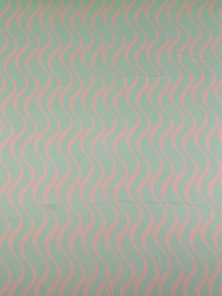 Seafoam Rhythm by Super Cheap Fabrics features a seamless pattern of wavy pink lines on a mint green background, perfect for breathable outfits with mercerised rayon. Width: 150cm.