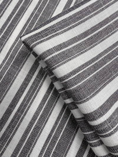 Close-up of two overlapping pieces of Super Cheap Fabrics' Linen Blend - Linen Stripe (150cm), featuring grey-white fabric with black and white horizontal and vertical stripes. The lightweight, woven texture enhances the design.
