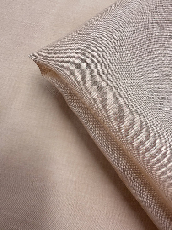 A close-up of two overlapping pieces highlights the delicate, soft texture of Designer Voile - Apple Blossom - 150cm by Super Cheap Fabrics, showcasing its lightweight and sheer quality.