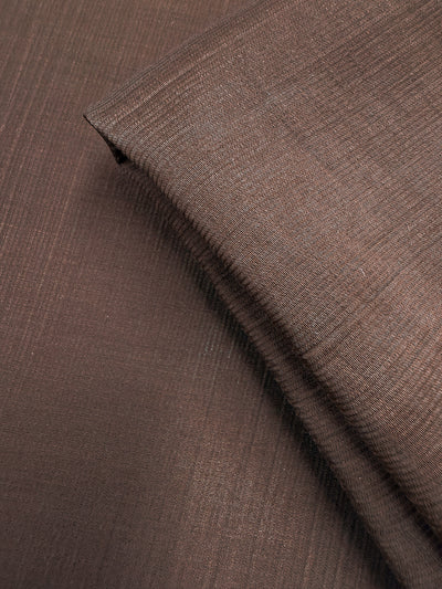 Close-up of Super Cheap Fabrics' Textured Designer Voile in French Roast (155cm), highlighting its lightweight, airy texture and delicate weave.