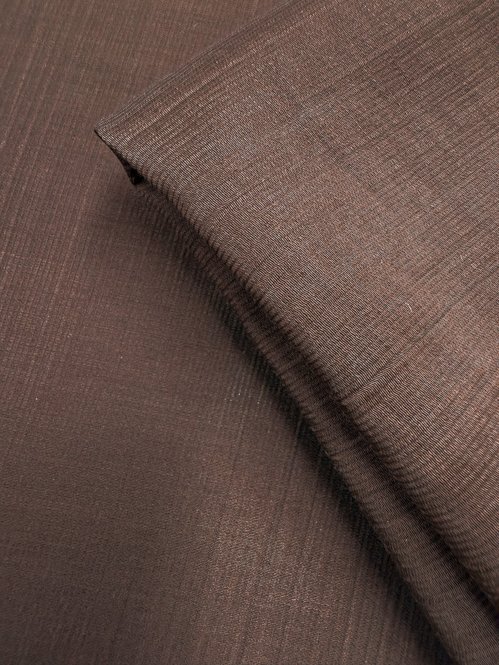 Close-up of Super Cheap Fabrics' Textured Designer Voile in French Roast (155cm), highlighting its lightweight, airy texture and delicate weave.