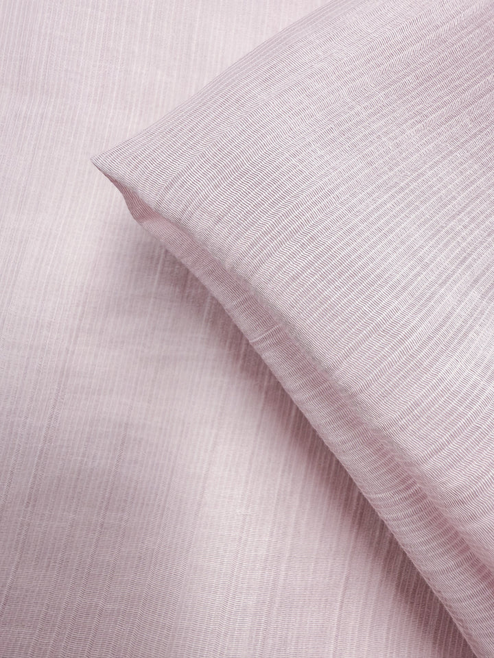 Close-up of Super Cheap Fabrics' Textured Designer Voile - Carinaria (155cm): lightweight cotton with a soft, smooth feel and delicate textured lines. One piece folded over another creates gentle shadows—ideal for sheer summer dresses.